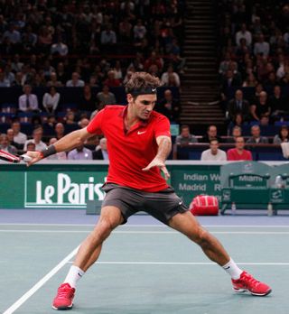 Federer in Raonič stežka čez uvodni krog Pariza; Pouille šokiral še Fogninija