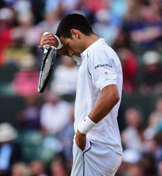 Djokovič bo reševal kožo jutri. Gilles Simon zmlel Berdycha.