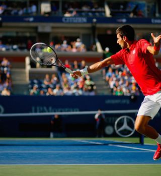 Djokovič povečuje ritem in brani Federerja; Wawrinka izločil Berdycha